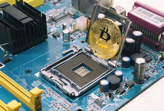 A mining farm worker inspecting a row of mining rigs.