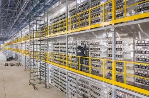 A large-scale mining farm with rows of mining machines.